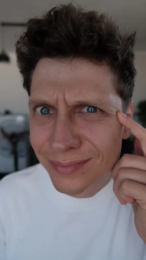 Millennial man confronting his changing appearance and signs of aging in mirror Stock-Footage 346709712