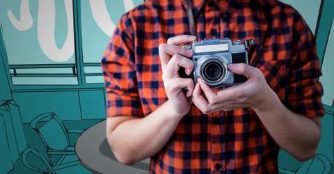 Millennial man mid section with camera against blue hand drawn office Stock Photos