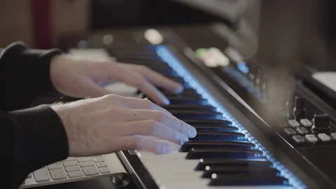 Millennial playing keyboard in recording studio Video stock 88053635