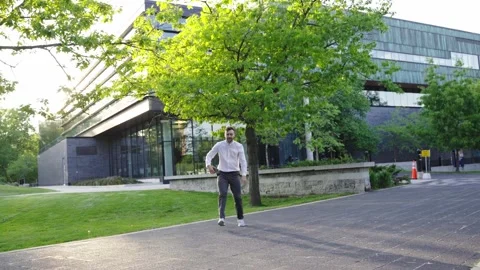 Millennial professional businessman Actively Dancing close to business center.  Stock Footage 244245037