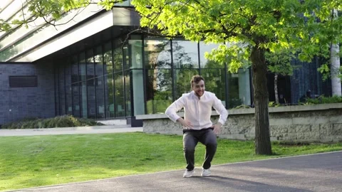 Millennial professional businessman Actively Dancing close to business center.  Stock Footage 244245122