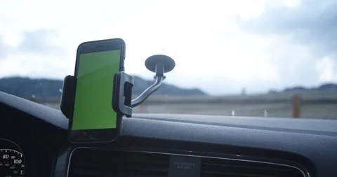 Millennial ride share driver accepts trip with click on phone app with car mount Stock Footage 88339545