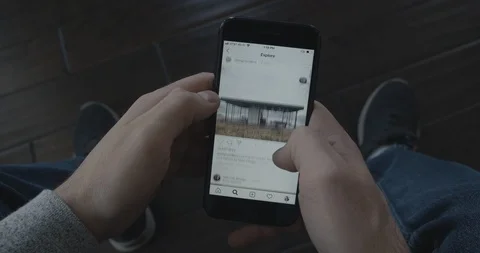 Millennial Scrolls Through Architecture-Themed Instagram Feed on Phone Video stock 102594210