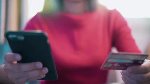 Millennial shopper paying on website ordering delivery mobile phone smartphon Stock Footage 265931427