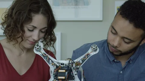 Millennial Tech Engineers Holding A Robot They Built 스톡 동영상 82404838