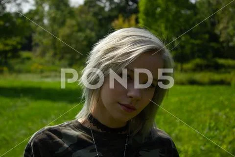 Millennial walking outside in the park - day Stock Photos