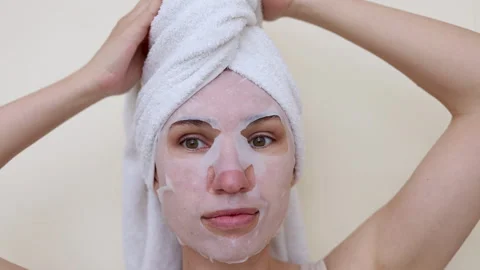 Millennial woman doing face procedures,applying under eye patches Stock-Footage 242990292