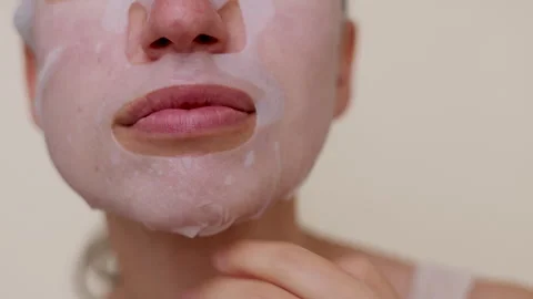 Millennial woman doing face procedures,applying under eye patches Stock-Footage 242990309