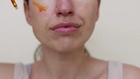Millennial woman doing face procedures,applying under eye patches Stock-Footage 242990326
