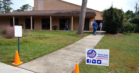 Millennial, young man exits polling place on November 6, 2018 Stock Footage 98823484