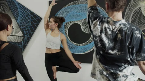 Millennials practicing yoga in modern loft studio Stock Footage 156242937