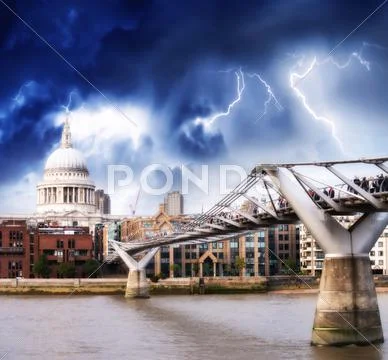 The millennium bridge and st paul cathedral. bad weather in london Stock Photos