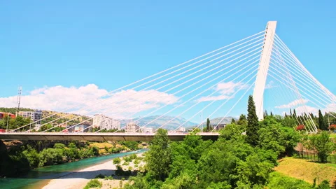 Millennium bridge over Moraca river by Podgorica, Montenegro cityscape Stock Footage 273823155