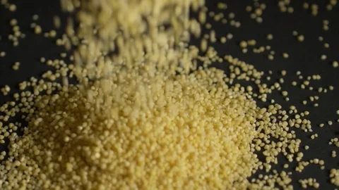 Millet falls on a black background Stock Footage 106707689
