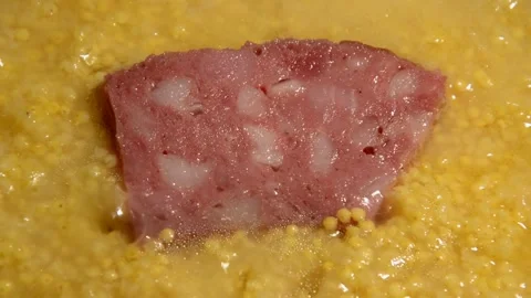 Millet with sliced sausage Stock Footage 314202707
