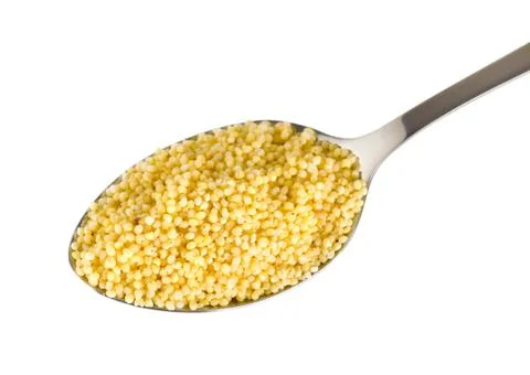 Millet in a spoon Stock Photos