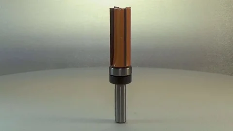 Milling cutter and router bit. Orange tools, pattern bit with bearing. Stock Footage 78359619