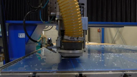 Milling cutter cuts plastic part on robotized production line Stock Footage 119398548