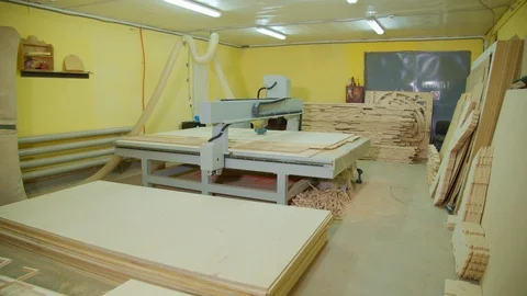 Milling machine with cnc in workshop wood furniture production. Stack plywood. Stock Footage 129101868