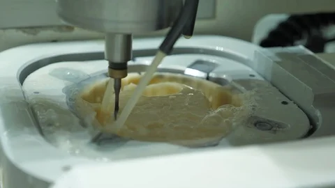 Milling machine creating dental implants Stock Footage 99921979