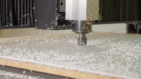 Milling machine cut the shape out of plastic canvas. A lot of flakes. Close up Stock Footage 129101899