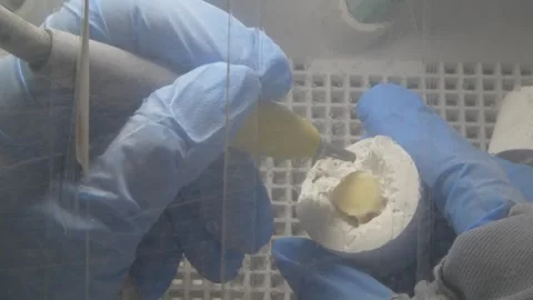 The milling machine cuts the ceramic dental crown from the workpiece. Stock-Footage 256581071
