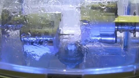The milling machine cuts the ceramic dental crown from the workpiece. Stock Footage 256581223