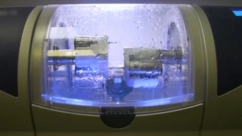 The milling machine cuts the ceramic dental crown from the workpiece. Stock Footage 256581256