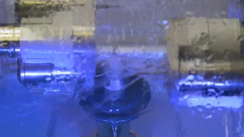 The milling machine cuts the ceramic dental crown from the workpiece. Stock Footage 256581259