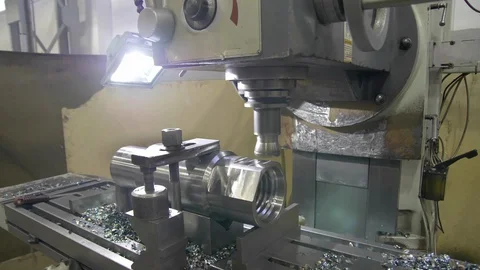 Milling machine cuts metal making part. Process of metalworking. Video stock 129104801