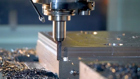 Milling machine in operation in a machine shop.  CNC metal manufacturing. Stock Footage 108678929