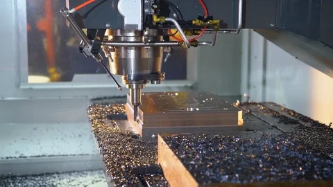 Milling machine in operation in a machine shop.  CNC metal manufacturing. Stock Footage 108678949