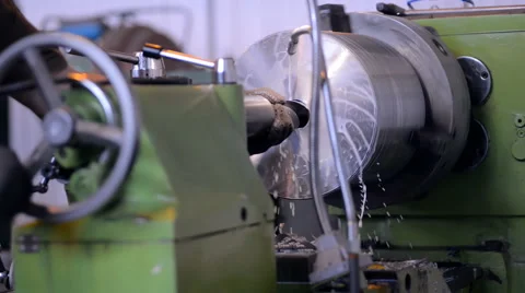 A milling machine operator working factory workshop makes some particular on Stock Footage 57688259