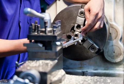 Milling machine operator working in factory workshop 스톡 사진