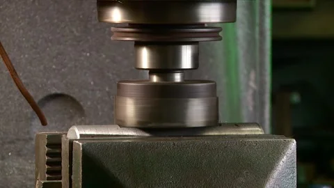 Milling machine sharpens a metal part close-up from the side Stock Footage 253800258