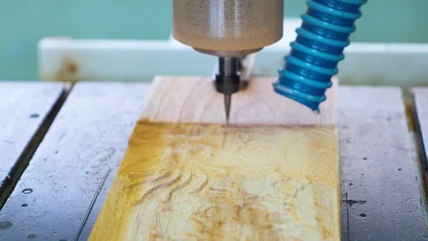 Milling machine tool carves out a pattern in a plank Stock Footage 124322929