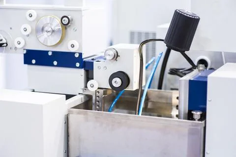 Milling machine tool with mill in chuck preparing to process metal detail at  Stock Photos