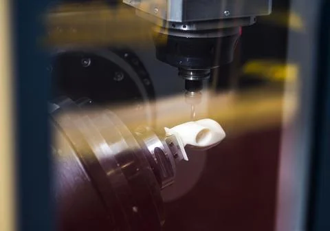 Milling machine tool with mill in chuck preparing to process metal detail at  Stock Photos