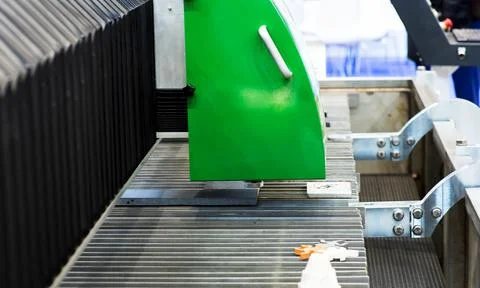 Milling machine tool with mill in chuck preparing to process metal detail at Stock Photos