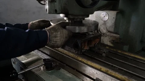 Milling machine. The worker sets the workpiece Stock Footage 75233904