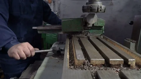 Milling machine. The worker sets the workpiece Video stock 75323455