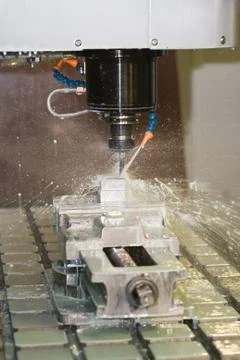 Milling machine working - cooling liquid Stock Photos