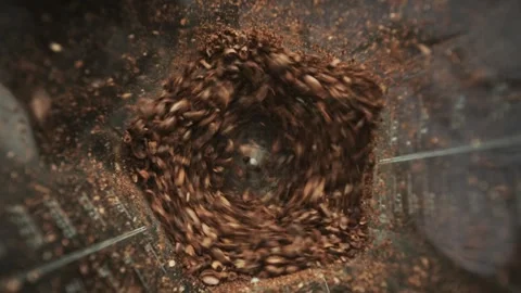 Milling roasted coffee beans in electric grinder, close-up top view Stock Footage 247113114