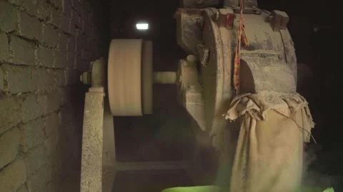 Milling wheat with a electric flour mill in a rural village of india Vídeos de archivo 318066735