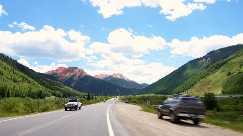 Million Dollar Highway road in Colorado driving pov cars and colorful mountain Stock Footage