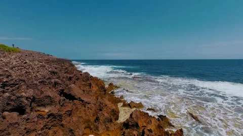 Million-Year-Old Ancient Red Coral Reef Shelf and Ocean Waves Stock Footage 337583048