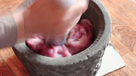Millstone pounding meat, making daily dish Stock-Footage 49708955
