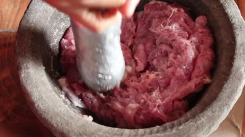 Millstone pounding meat, making daily dish Stock Footage 49708965