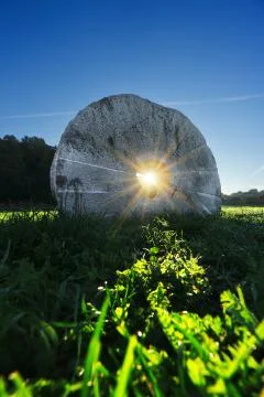 Millstone with sun rays inside Stock Photos