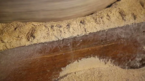 Millstone in a watermill grinds corn  1 of 7 Stock Footage 54522695